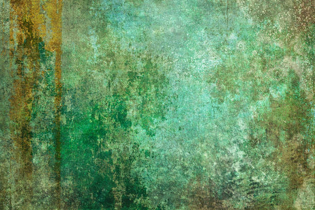 A heavily weathered metal surface displays the natural patina process of aged copper, with rich green verdigris oxidation blending into golden rust stains and darker corrosion spots that create an organic abstract pattern. The image symbolizes the beauty found in decay and transformation, representing how time and natural processes can create unexpected artistry from industrial materials, turning weathering into a testament to endurance and natural chemistry.