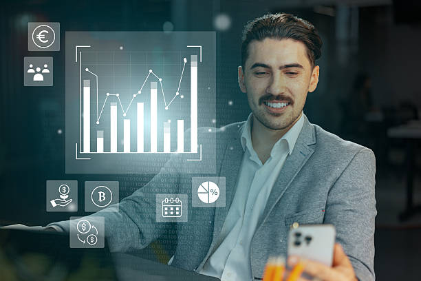 Business professional engaged in digital finance analysis in a modern office setting during daytime