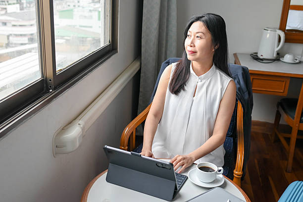 istock Smiling Professional Woman Focused on Work at Desk 2227813716
