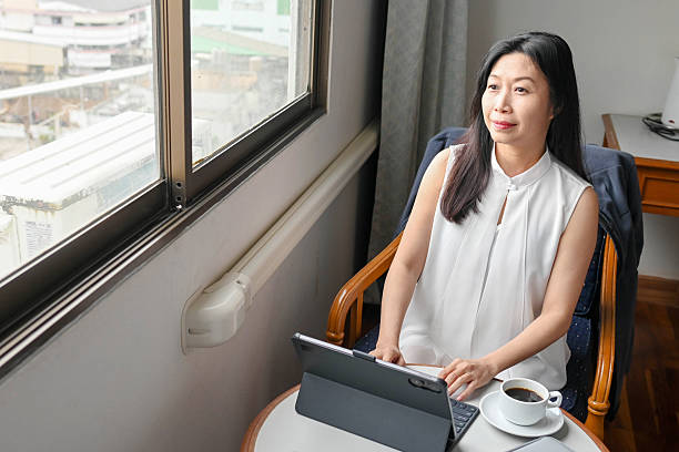 istock Happy Female Executive Using Laptop in Modern Workplace 2227813717
