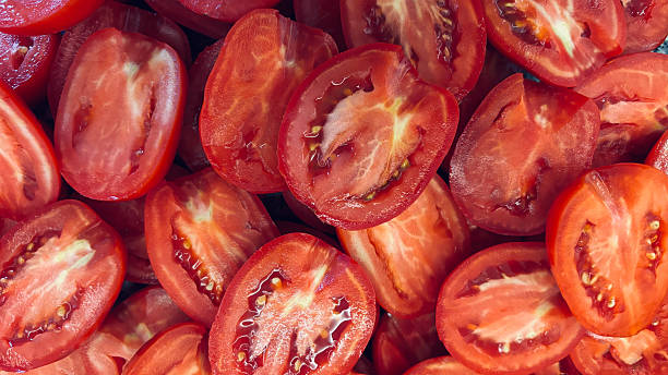 istock Close-up Background of Sliced Ripe Tomatoes 2227820600