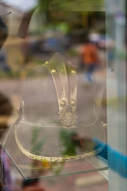 A vintage diving helmet in monochrome tones.