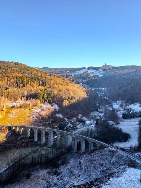 istock Winter sunset over railway stone bridge in Novina 2227825411