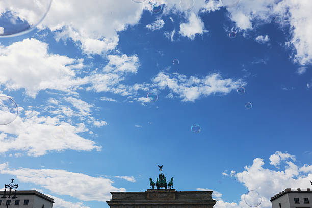 A soap bubble in a park reflecting spectrum