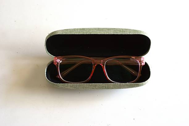 istock Stylish optical glasses in a storage box on a white background 2227826582