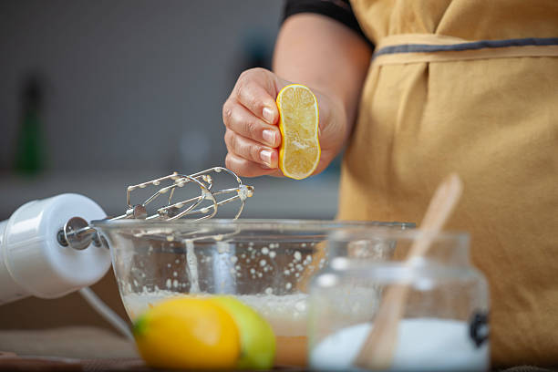 istock Woman squeezing lemons in a bowl 2227826583