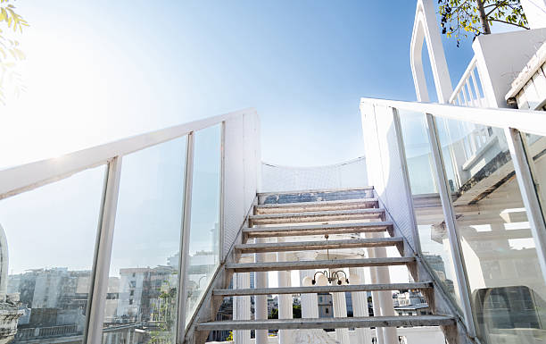 Metal staircase with glass railing