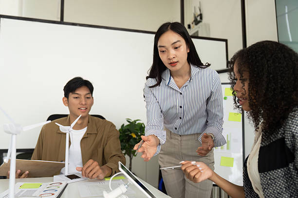 istock Sustainability in Action: Team Collaboration on Eco-Friendly Project 2227831499