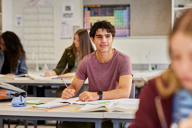 istock Confident teen learning at high school during lesson 2227832277
