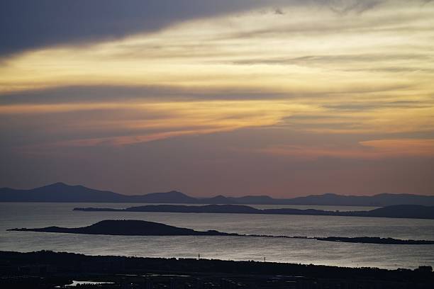 Taihu Lake, China, with its islands and distant mountains at sunset