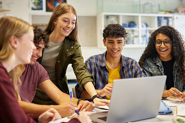 istock Happy smiling teens students studying in group 2227837053