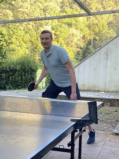 istock Backyard Ping Pong Match with Enthusiastic Player 2227840249