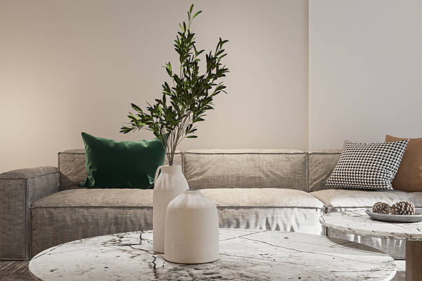istock Cozy Living Room Scene- Sofa, Marble Table, and Elegant Floral Decor. 2227842308