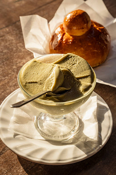 Sicilian pistachio granita with brioche served on outdoor table at golden hour