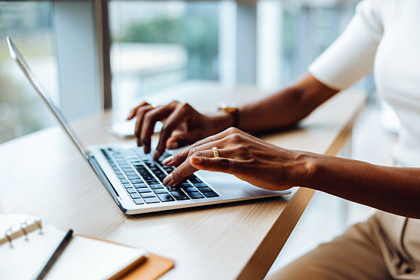 istock Person typing on a laptop at a desk during the day 2227842838