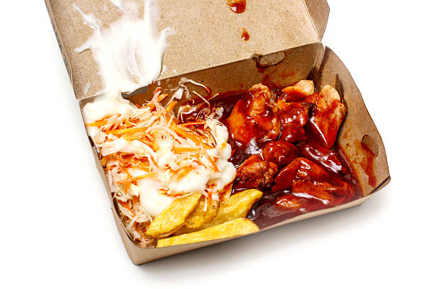 barbecue grilled chicken with fries and salad, in a packaging box