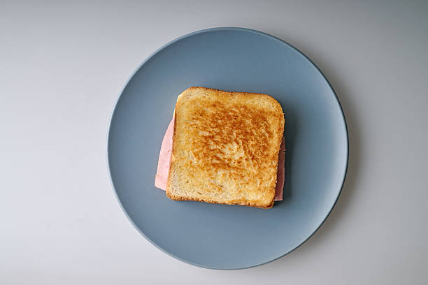 istock Crusty croque-monsieur on blue plate 2227846184