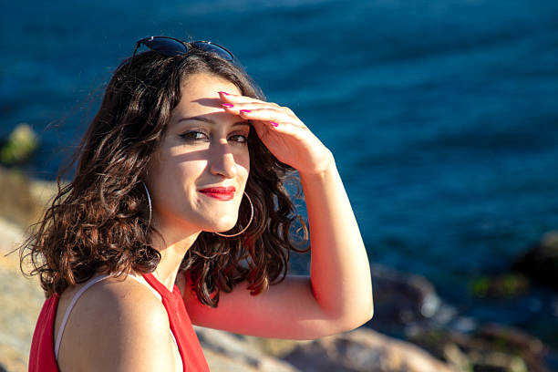 Young woman sitting in front of the Bosphorus
