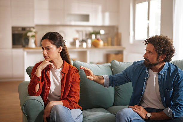 istock Frustrated couple arguing and having relationship problems at home 2227846532