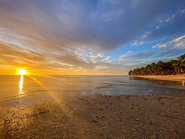 istock Sunset Over the Sea in Mauritius with Beach and Palm Trees 2227848678