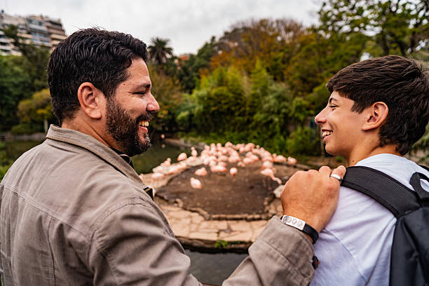 istock Father and son talking at a zoo 2227848832