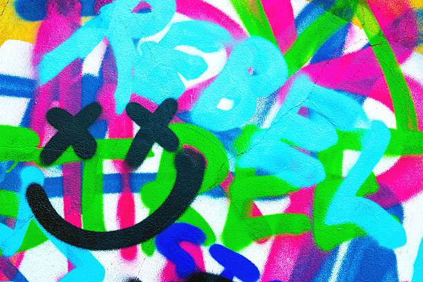 Phoenix, AZ: A man walks past a colorful wall mural near Central Ave in downtown Phoenix.