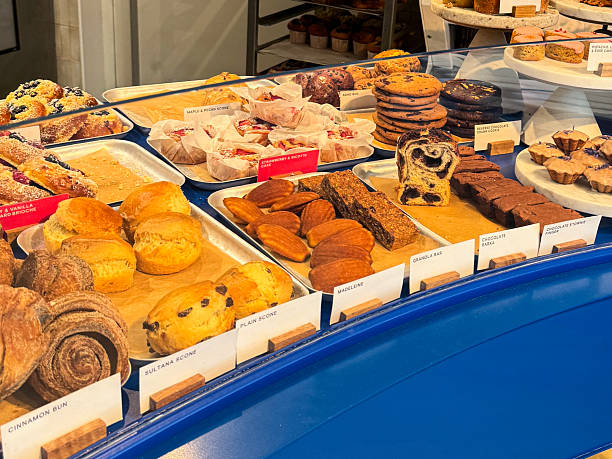 istock Image of assorted bakery pastries featuring freshly baked croissants, cupcakes, muffins, cakes and cinnamon whirls 2227850334
