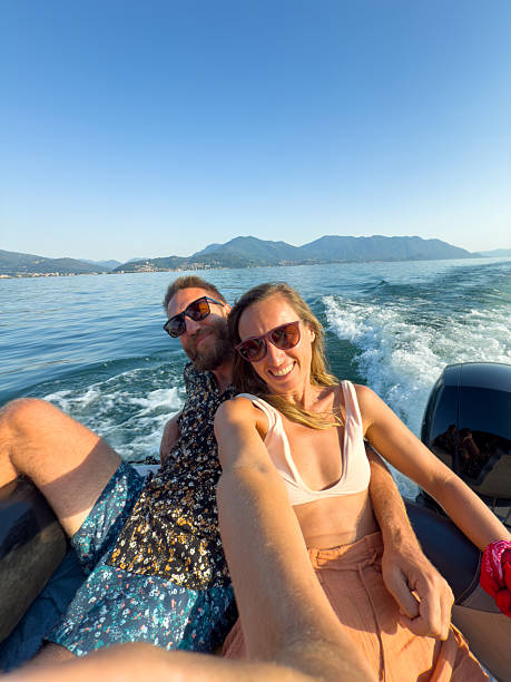istock Happy Couple Taking Selfie on Speedboat Ride 2227851045