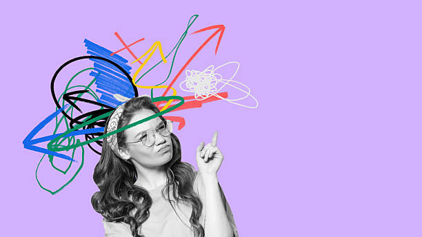 istock Artistic visual of confused girl with messy arrows and chaotic scribbles around head 2227851226