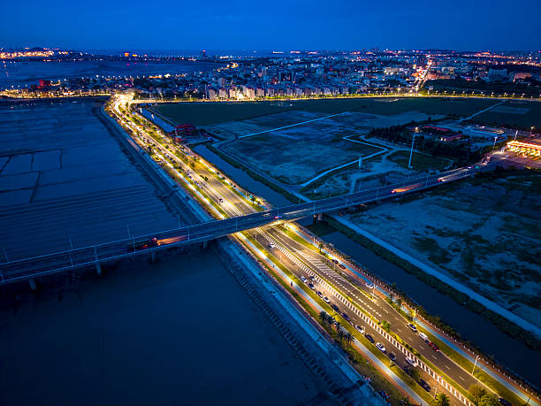 istock Urban Night Skyline with Illuminated Roadway 2227851671
