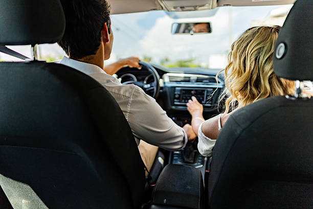 Couple inside car during road trip