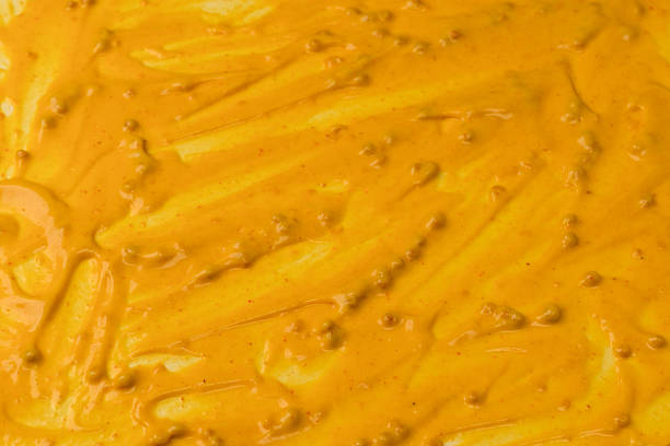 istock Yellow sauce splashes as a background. 2227858004