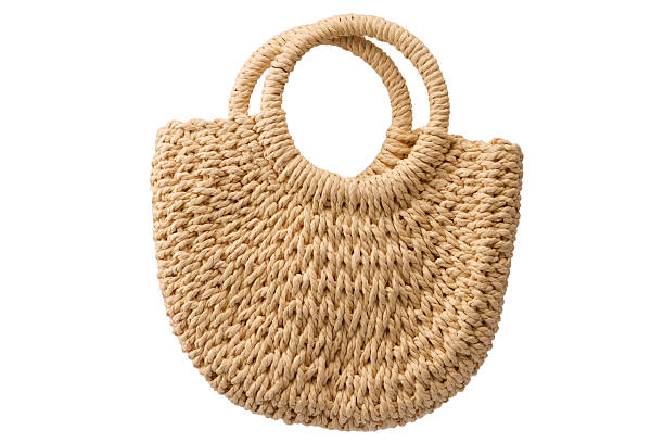 istock A beige straw bag isolated on a white background. 2227858034