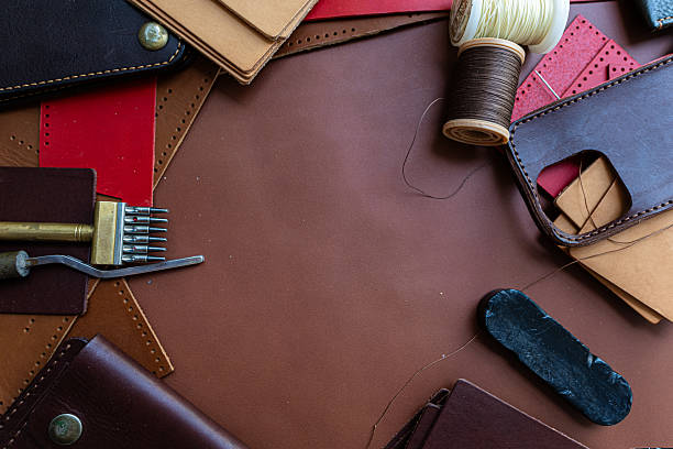istock Background of genuine leather wallet craftmanship working with tool 2227862841
