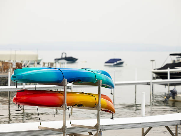 istock Two kayaks stored on drydock scaffold attached to dock 2227865599