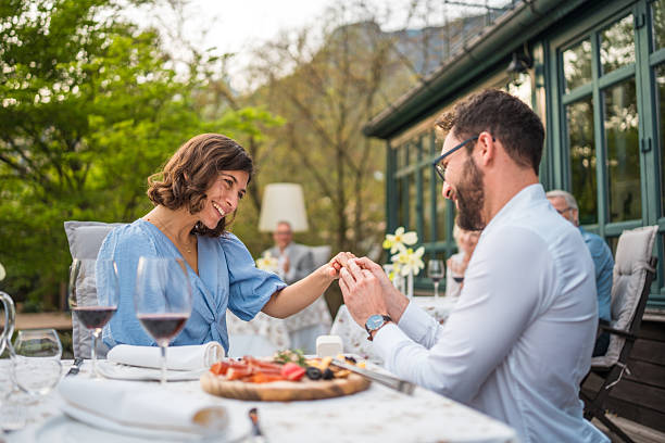 istock Joyful Engagement Moment Between Diverse Couple at Hotel Terrace 2227867671