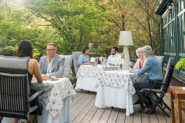 istock Diverse Friends Enjoy Outdoor Dining Experience 2227867680