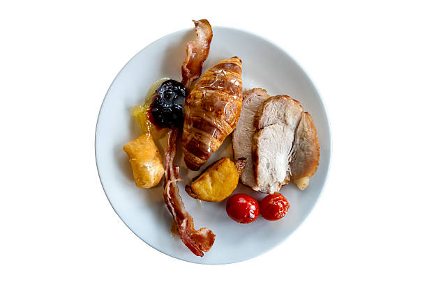 Simple breakfast in white ceramic dish isolated on white background with clipping path.