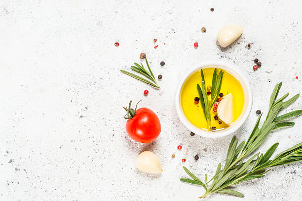 istock Herbs, spices and vegetables at white kitchen table. 2227869492