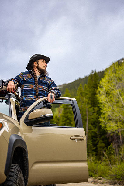 istock Single Attractive White Man Wearing Cowboy Hat, Standing Alone in the Wilderness Looking Out 2227871904