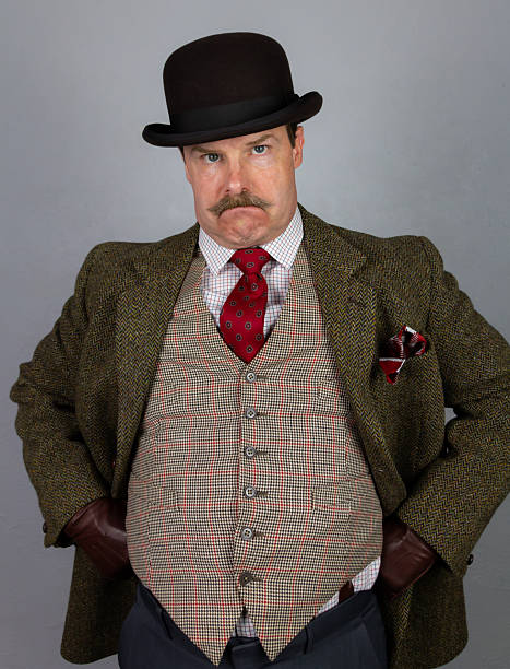 istock Vintage British Gangster or Detective in Tweed Suit and Bowler Hat With Grumpy Expression 2227874177