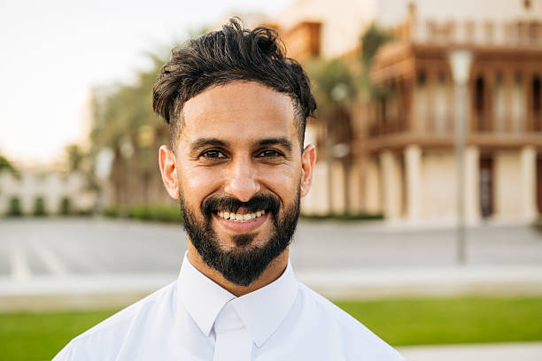 istock Portrait of handsome Saudi man with beard smiling towards camera 2227874357