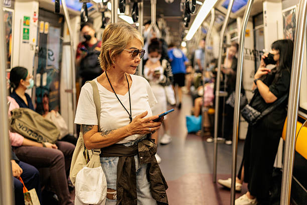 istock Stylish Senior Woman Standing in Subway 2227874659