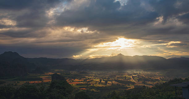 istock Scenic view dramatic beautiful sunset sky. Natural Sunset Sunrise on meadow silhouette shadow dark land. Vibrant dramatic sky on sunset, dawn, sunrise in Countryside. Landscape Colorful Sky At Sunset 2227874951