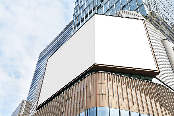 istock Mock up white corner LED display billboard on shopping mall building. Clipping path for mockup 2227875528