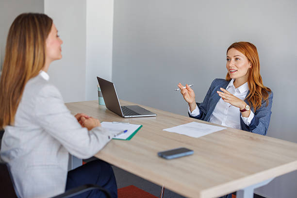 istock Two businesswomen having a conversation in the office 2227876456