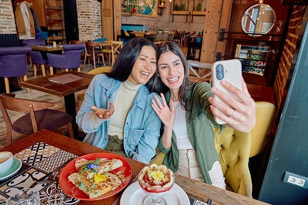 istock Two young women taking a selfie in a restaurant while having breakfast 2227877118