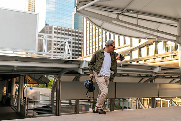 istock Man in a Hurry Checking His Watch While Walking 2227877702