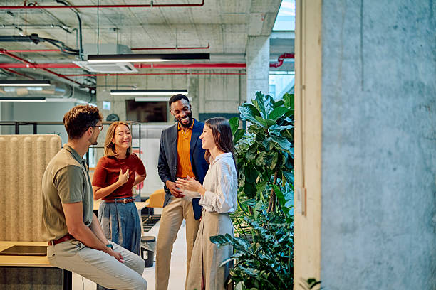 istock Business team discussing new project in modern office with plants 2227879550