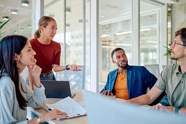 istock Diverse Business Team Discussing Project During Meeting in Modern Office 2227879941
